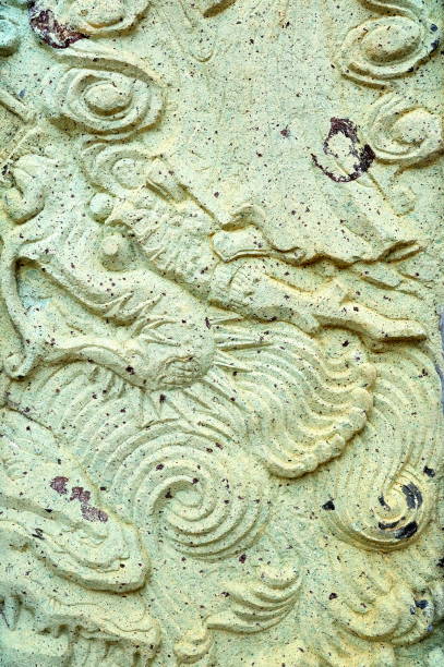 istock Vintage Thai Sculpture on Stone Wall. 950118670