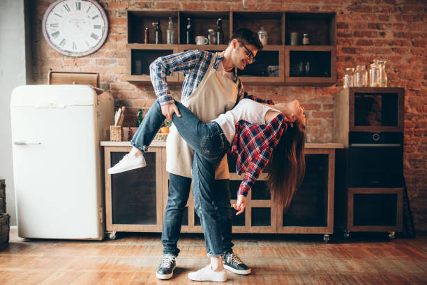 istock Playful love couple poses on the kitchen 950119454