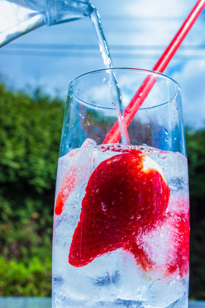 istock Strawberry drink poured from a pitcher into glass 950130284