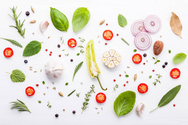 istock Various fresh herbs for cooking ingrediens peppermint , sweet basil ,rosemary,oregano, sage ,chilli bay leaves and lemon thyme on white wooden background with flat lay . 950131004