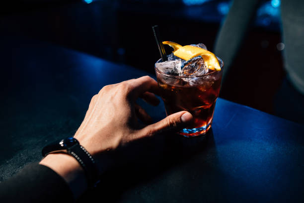 istock cocktail in hand on the bar 950131328
