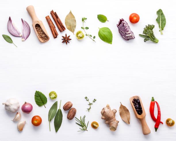 istock Various fresh vegetables and herbs on white background.Ingredients for cooking concept sweet basil ,tomato ,garlic ,pepper and onion with flat lay. 950132666