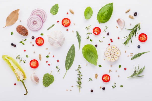 istock Various fresh herbs for cooking ingrediens peppermint , sweet basil ,rosemary,oregano, sage ,chilli bay leaves and lemon thyme on white wooden background with flat lay . 950132684