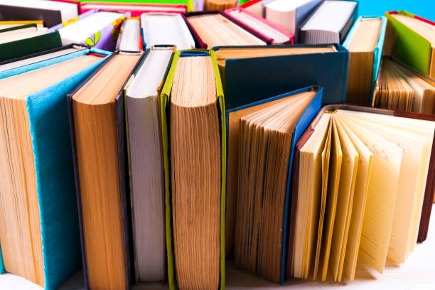 istock Open book, hardback books on bright colorful background. 950144954