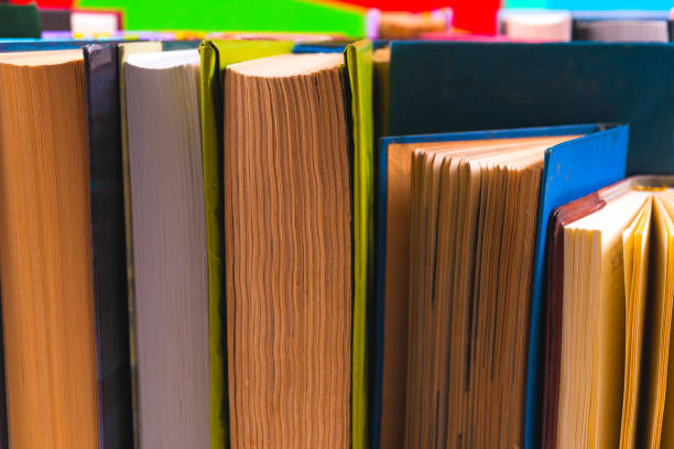istock Open book, hardback books on bright colorful background. 950144980