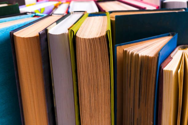 istock Open book, hardback books on bright colorful background. 950145022