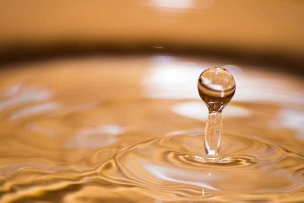 istock Shining drop of water colored of orange isolated composition 950148120