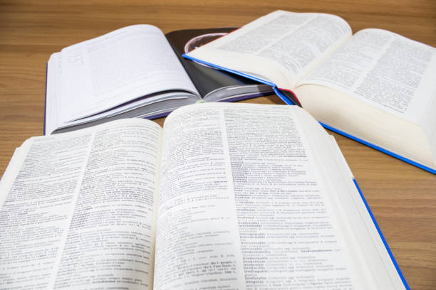 istock School, many open books on a wood table composition 950148276