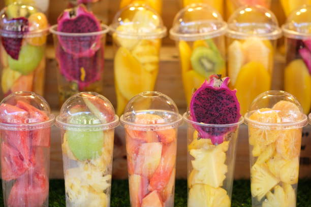 istock Fruits in the plastic cup for mix as juice - soft focus 950148474
