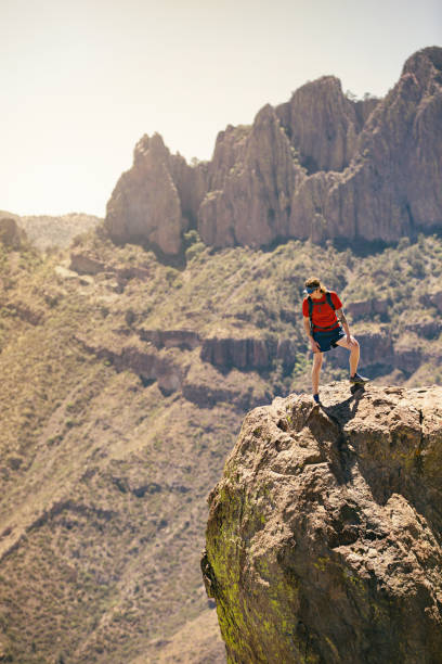 istock Man Standing on Rock Overlook 950166998