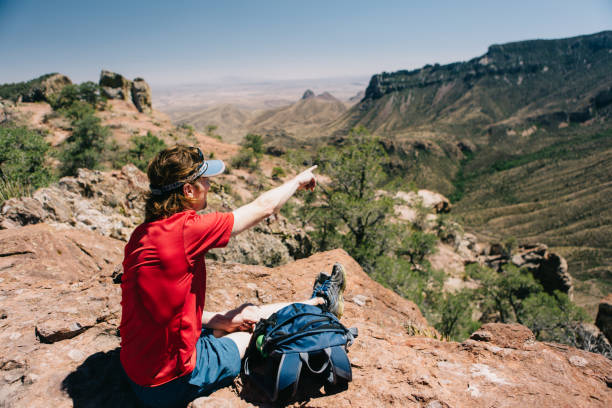 istock Man sitting and looking at the mountain view 950169238
