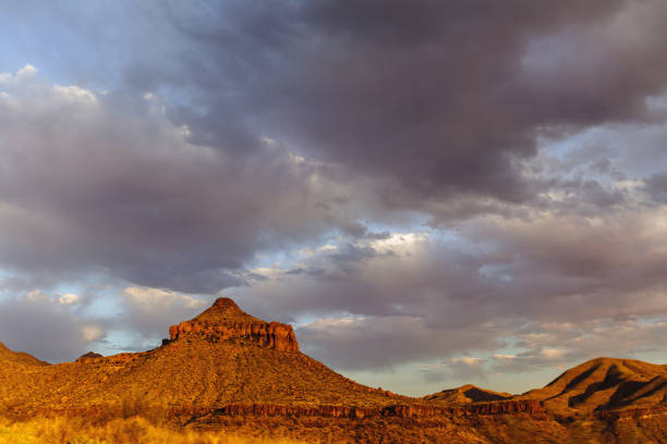 istock Dramatic sunset and sky over desert landscape 950172794