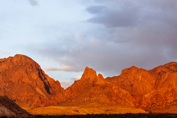 istock Dramatic sunset and sky over desert landscape 950172878