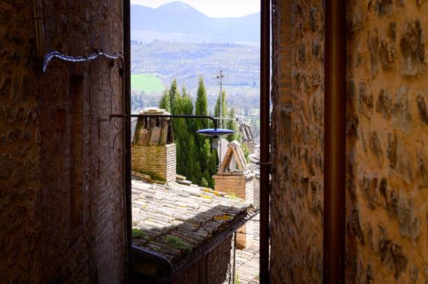 istock Italian landscape, view between medieval buildings (Spello, Umbria, Italy) 950176440