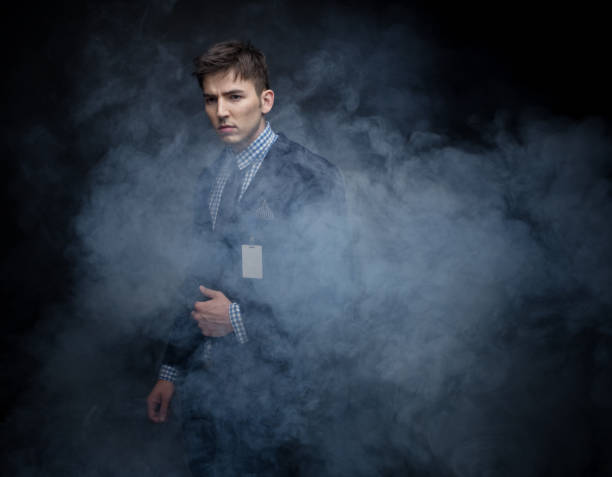 istock Well dressed businessman standing in amongst fog 950183712