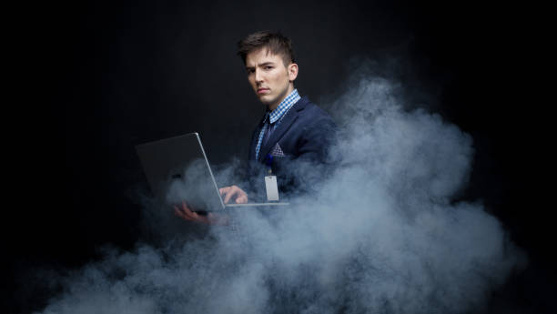Well dressed businessman in fog, like cloud computing