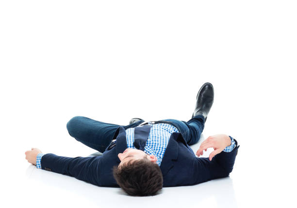 istock Handsome businessman knocked out on the ground 950189220