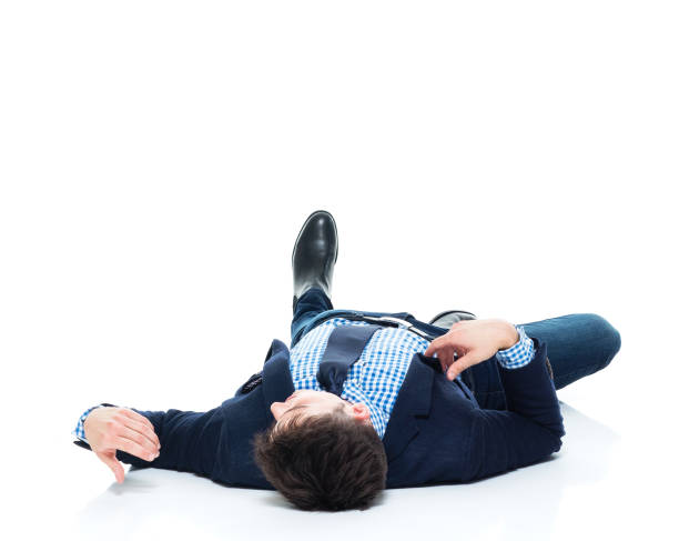 istock Handsome businessman knocked out on the ground 950189226