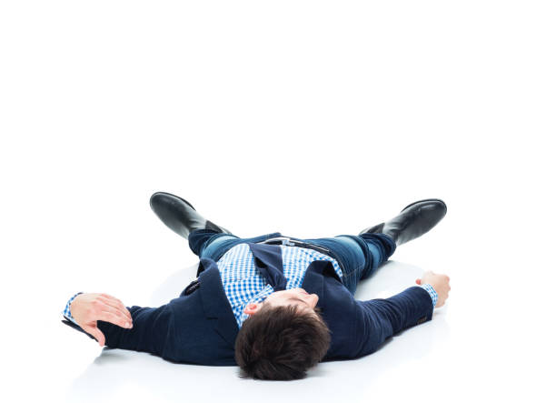 istock Handsome businessman knocked out on the ground 950189278