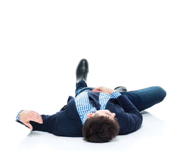 istock Handsome businessman knocked out on the ground 950189296