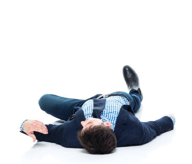 istock Handsome businessman knocked out on the ground 950189426