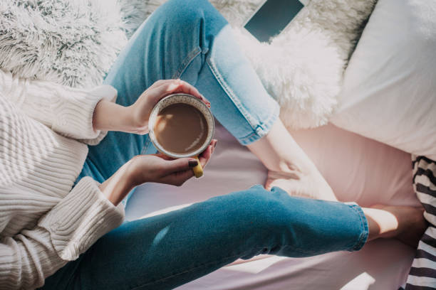 istock Young millennial woman enjoying her coffee 950189556