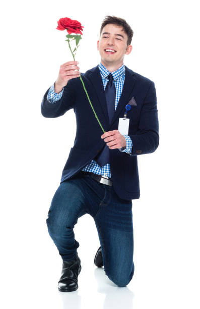 istock Attractive businessman being romantic with a rose 950189862