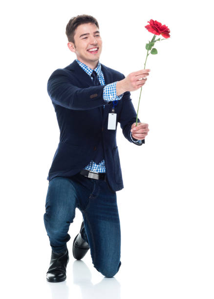 istock Attractive businessman being romantic with a rose 950189910