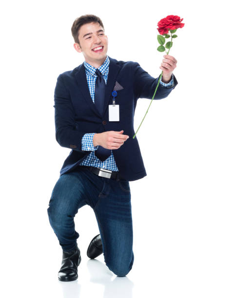 istock Attractive businessman being romantic with a rose 950190114