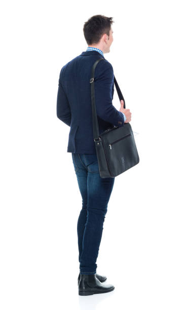 istock Handsome businessman with phone, paperwork and shoulder bag 950190170