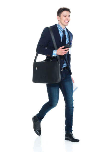 istock Handsome businessman with phone, paperwork and shoulder bag 950190390