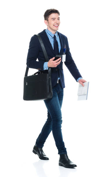 istock Handsome businessman with phone, paperwork and shoulder bag 950190406