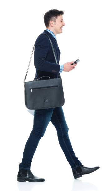 istock Handsome businessman with phone, paperwork and shoulder bag 950190546