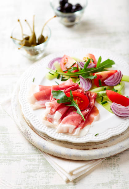 istock Vegetable salad with serrano ham on a plate 950192800