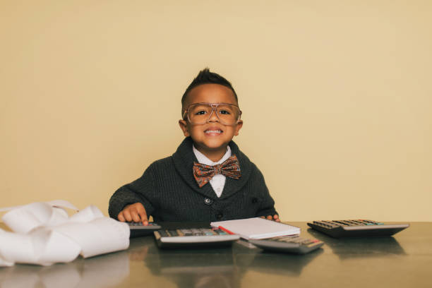 istock Young Accountant Boy Doing Taxes at Desk 950193152