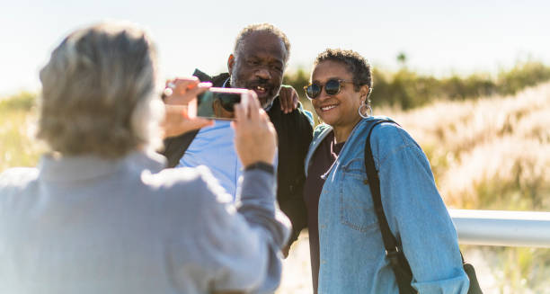 istock Senior friends take selfie at the beach 950194026