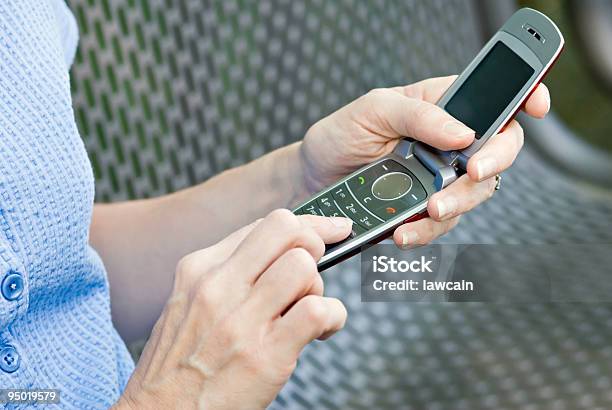 Woman Using Cell Phone Stock Photo - Download Image Now - Adult, Answering, Blue