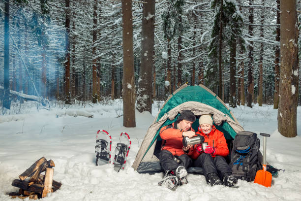 istock desperate tourists with tea at halt in the winter cold forest 950196318