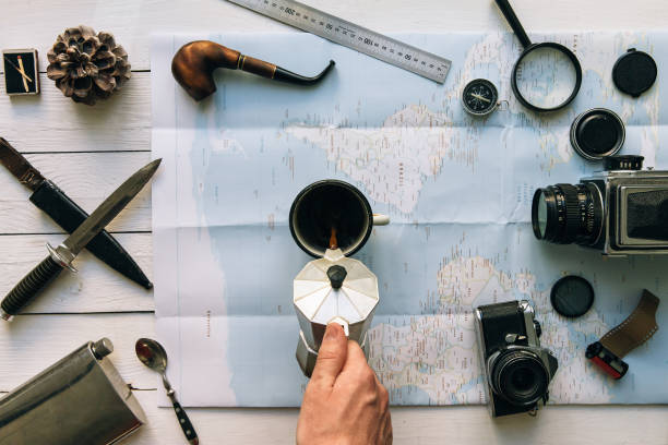 istock Vintage travel gear on white wooden table 950196564