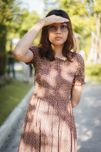 istock Asian woman looking for someone 950207746