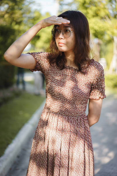 istock Asian woman looking for someone 950207756