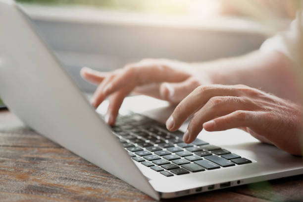 istock Young male freelancer sitting in cafe working in laptop 950225888