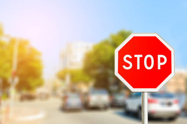 istock Stop sign by the City road with light effect 950233122