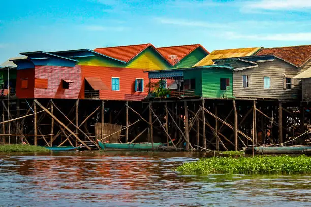 Photo of Colorful, multicolored stilt houses in Lake Tonle Sap near Siem Reap in Cambodia