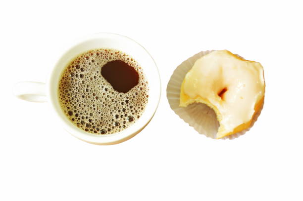 クリーム ドーナツ一口とブラック コーヒー カップ - donut caffeine coffee cream ストックフォトと画像