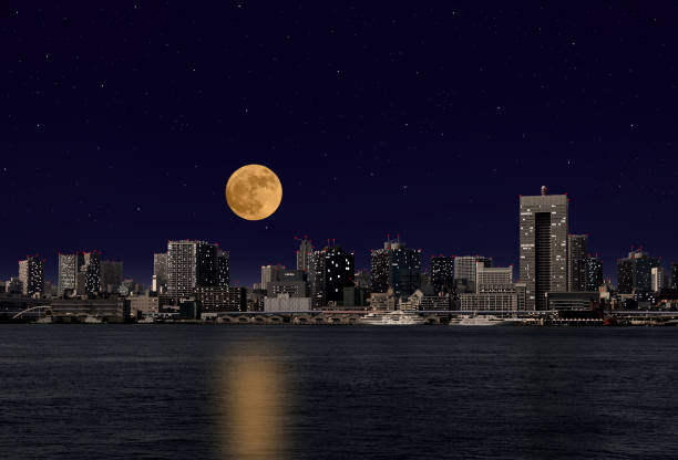 istock Full moon rising over the Tokyo bay area 950241080