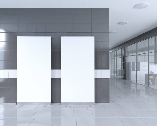 istock Blank roll up banner stand in bright office interior with clipping path around ad stand. 3d illustration 950249708