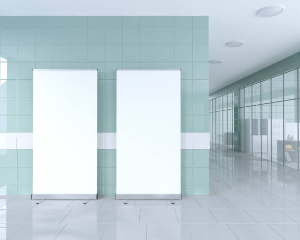 istock Blank roll up banner stand in bright office interior with clipping path around ad stand. 3d illustration 950249752