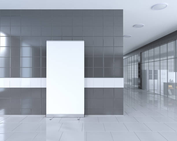 istock Blank roll up banner stand in bright office interior with clipping path around ad stand. 3d illustration 950249760