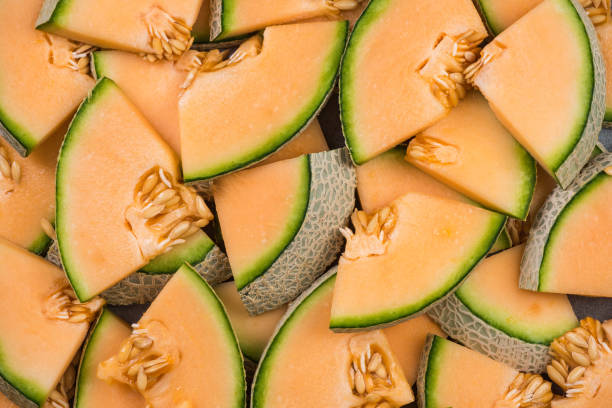 istock Cantaloupe melon slices, full frame food background 950253632